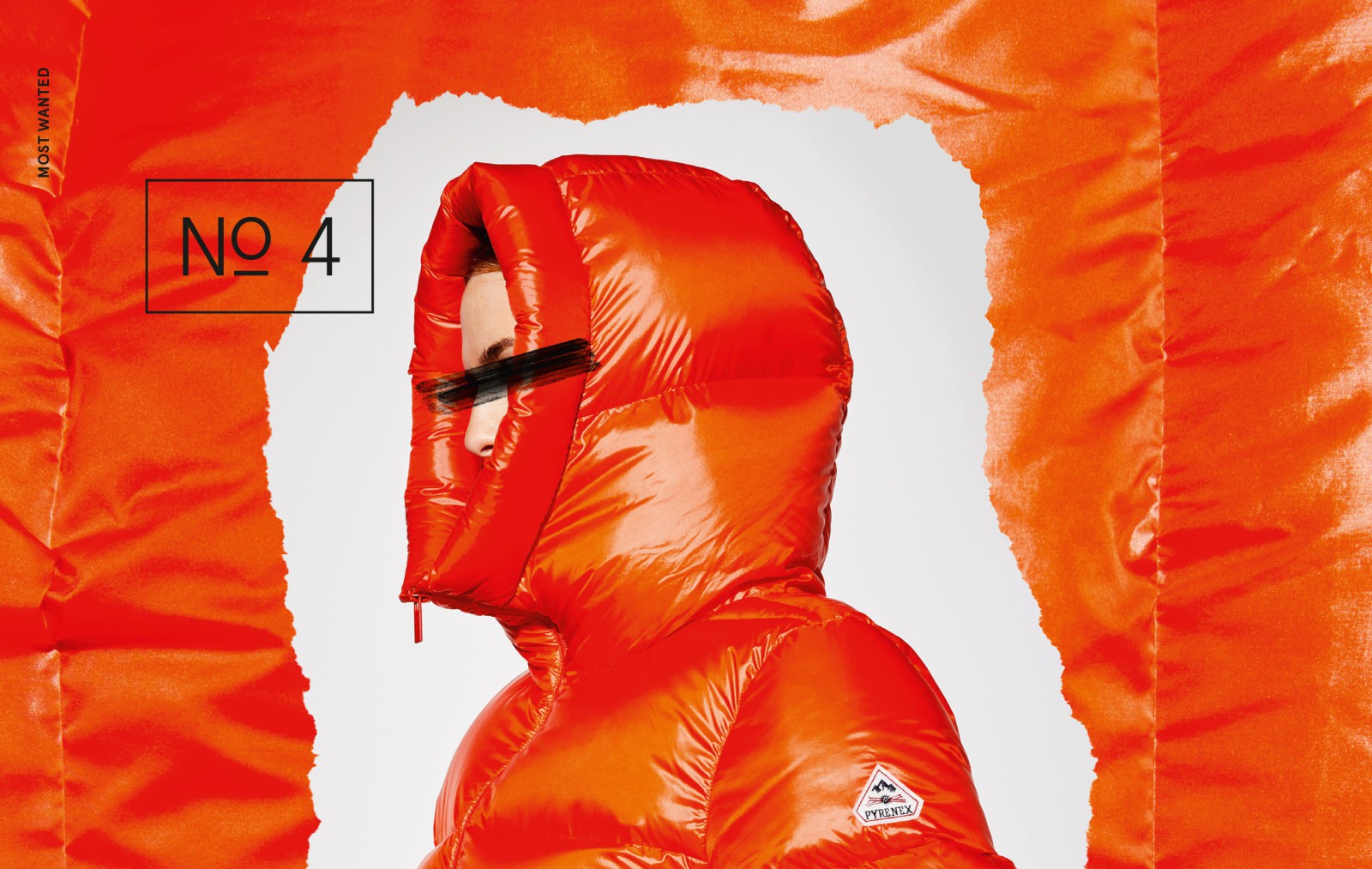 Großformatiges J'N'C-Mode-Editorial: Person in leuchtend orangefarbenem glänzenden Pyrenex-Daunenjacke vor einem zerrissenen orangefarbenen Hintergrund, beschriftet mit „Most Wanted – No. 4"